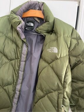 The North Face Olive Green Jacket with Gray Lining and Red Logo Tag